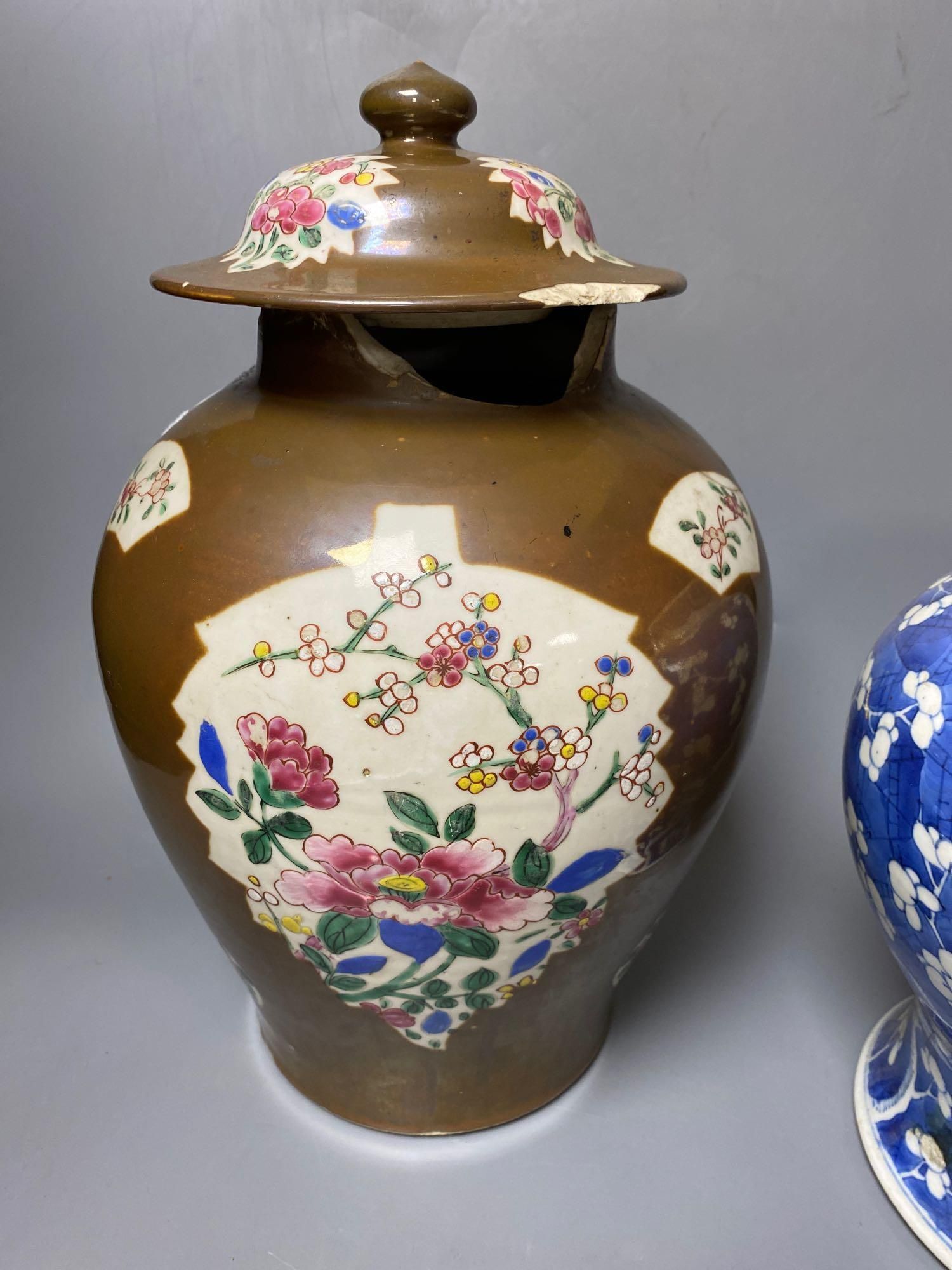 Two Chinese Kangxi period blue and white vases and a Qianlong Batavia vase and cover, largest 36cm high including the cover